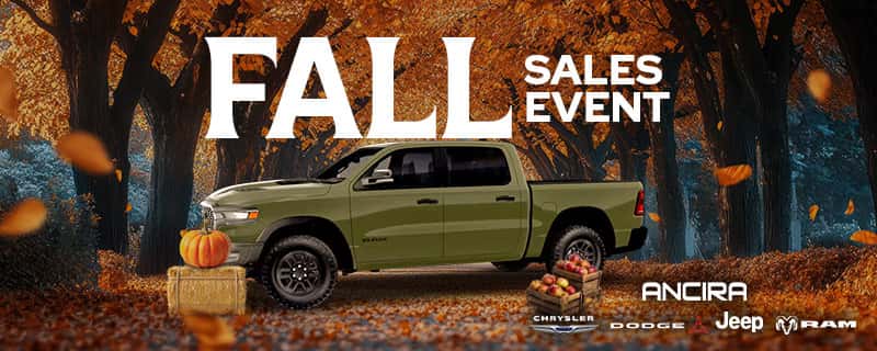 Promotional banner for the Ancira Fall Sales Event featuring a vehicle surrounded by autumn foliage, a pumpkin on a hay bale, and wooden crates filled with red apples.
