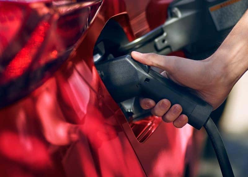 filling gas in 2020 toyota red prius