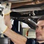 Man performing service under car
