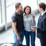 Young couple talking to salesperson