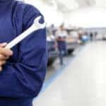 Automotive tech with a wrench