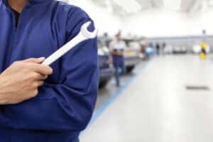 Automotive tech with a wrench
