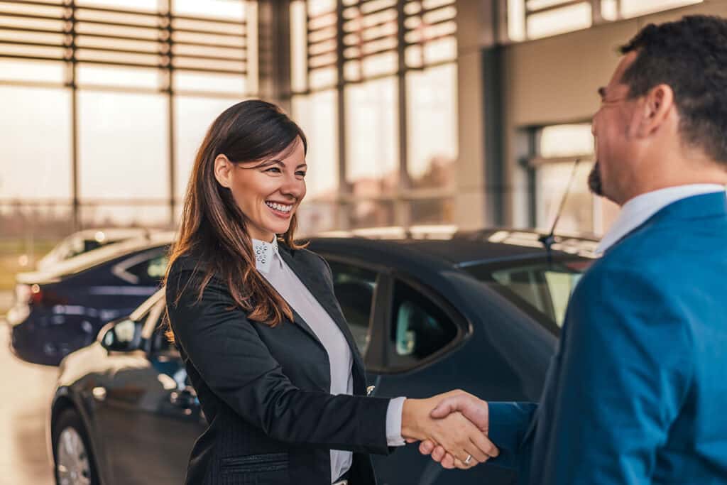 Sales rep shaking hands with customer