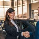 Sales rep shaking hands with customer