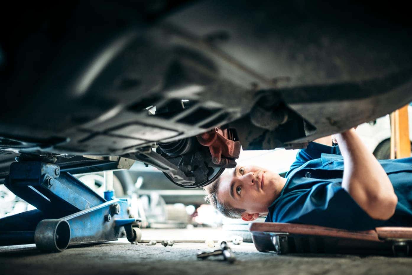 Mechanic working under vehicle