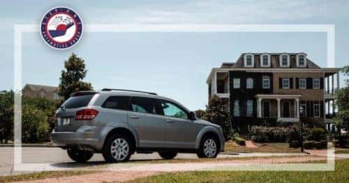 SUV parked in front of house