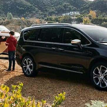 2022 Chrysler Pacifica Hybrid Towing a boat by a lake
