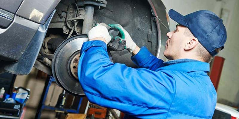 Mechanic working on brakes