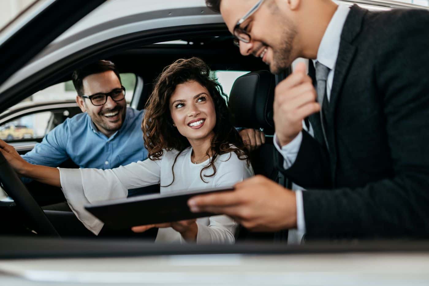 Finance expert with couple buying a Chevrolet vehicle