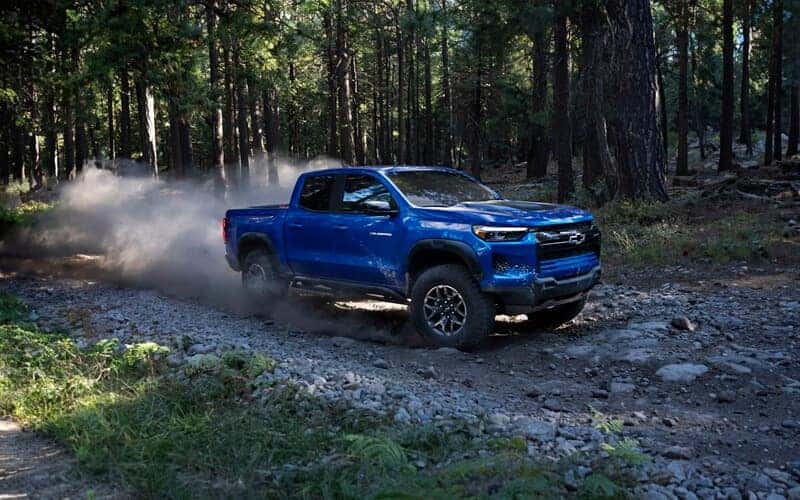 Chevrolet truck driving in the woods