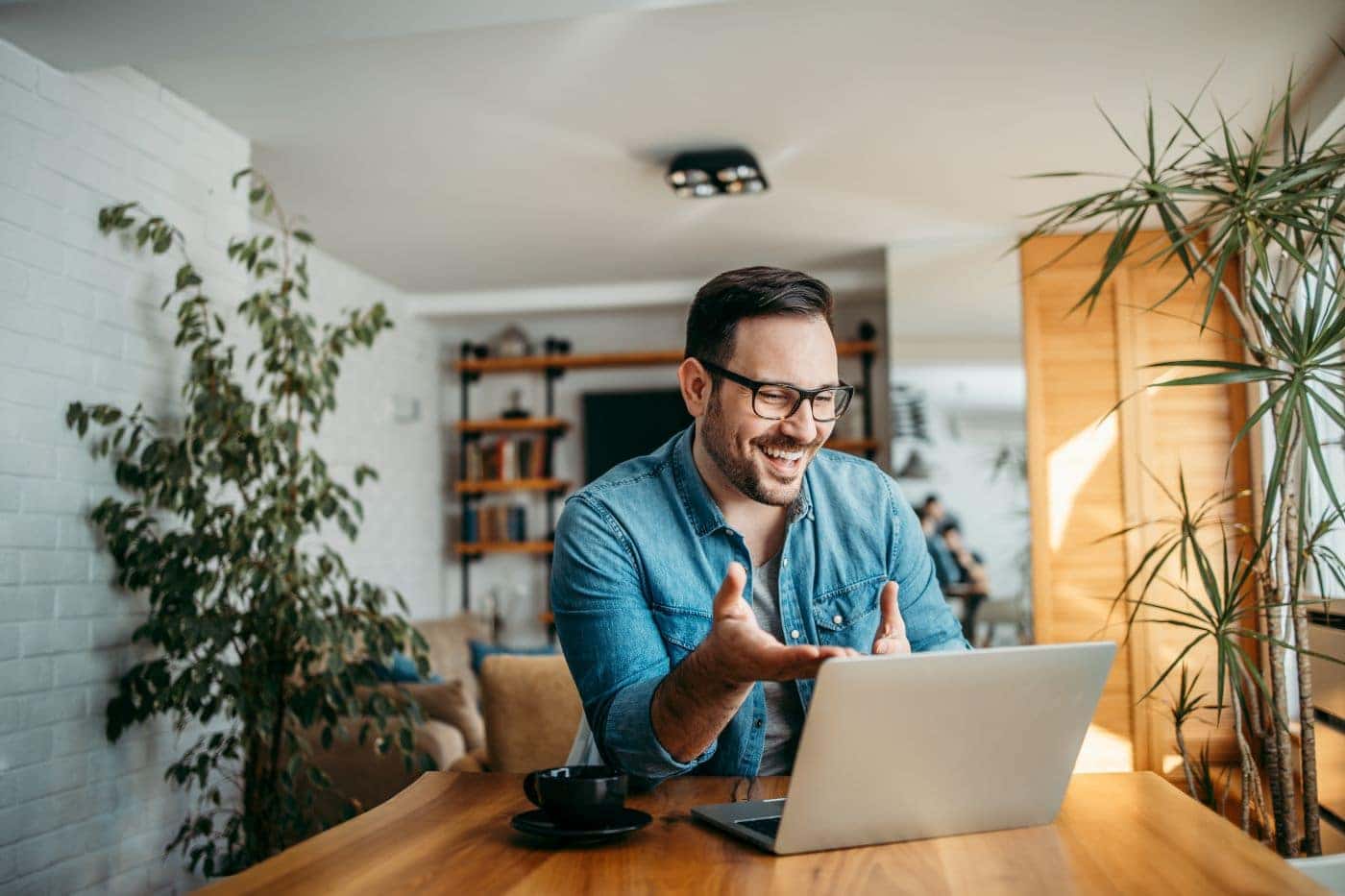 Man talking in a meeting on computer