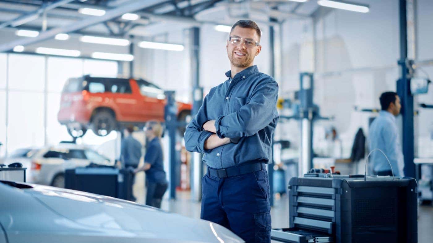 Service technician smiling in service center