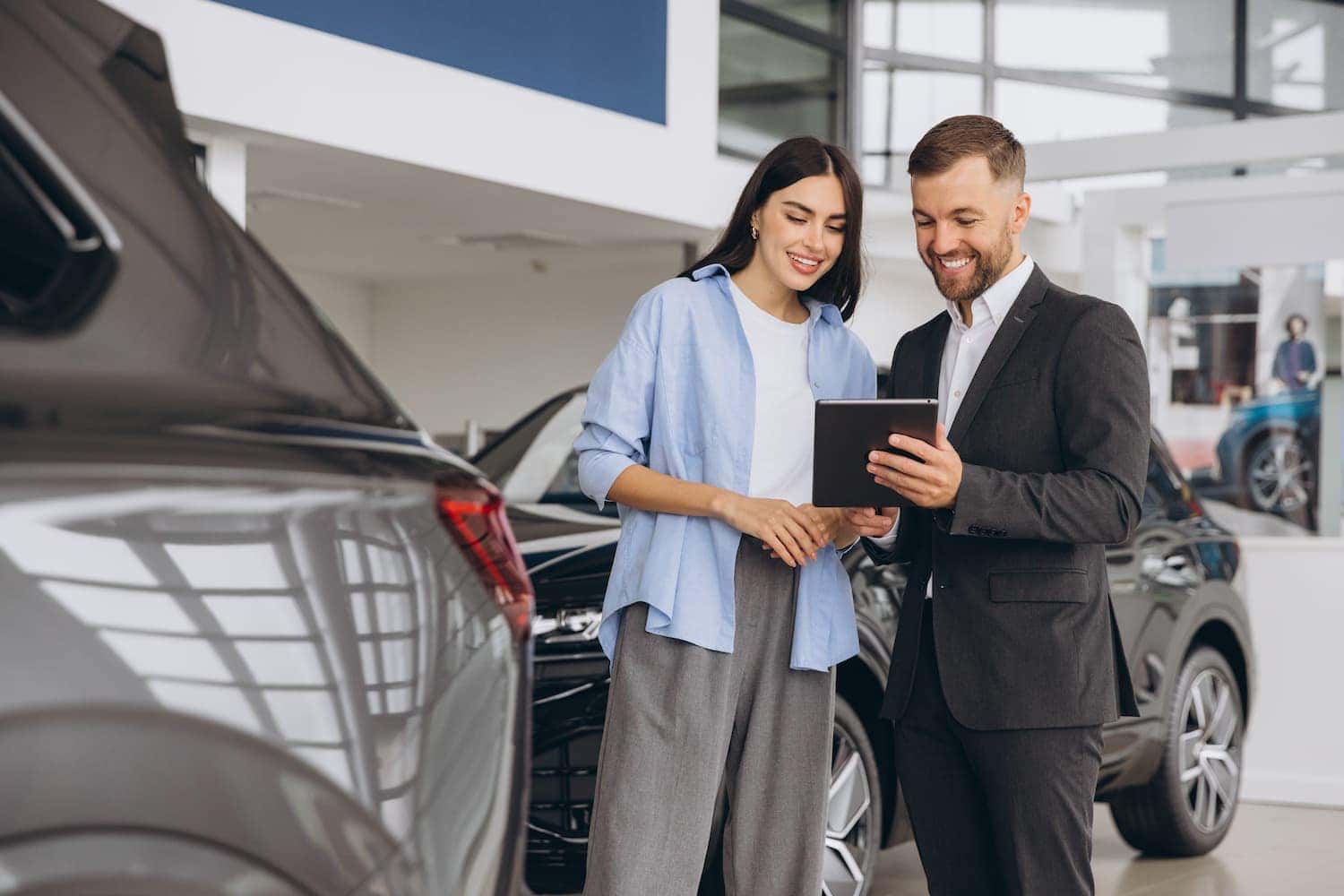 Chevy shoppers comparing new and used vehicles at DeNooyer Chevrolet in Colonie near Albany NY