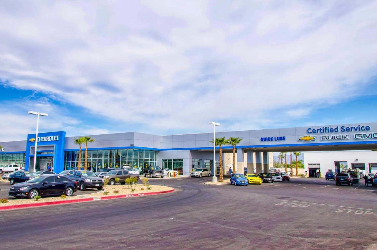 An exterior shot of a Chevrolet dealership at night.