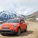 Orange 2018 FIAT 500X Driving Through Valley