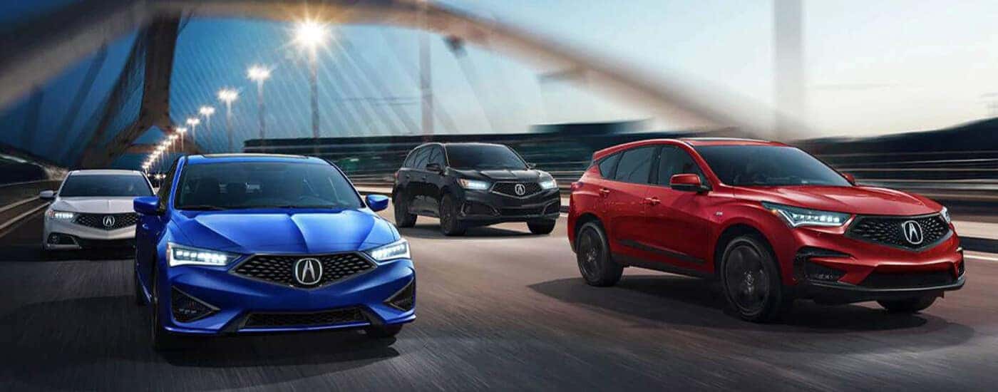 Acura models driving down a bridge