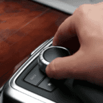 Hand operating a COMAND Controller inside a Mercedes-Benz