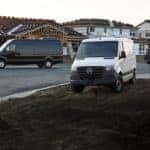 Mercedes-Benz vans parked near construction site