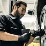 Mercedes-Benz technician working on wheel