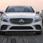 Head-on view of parked white C-Class Sedan