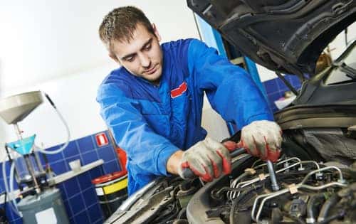 technician working on engine