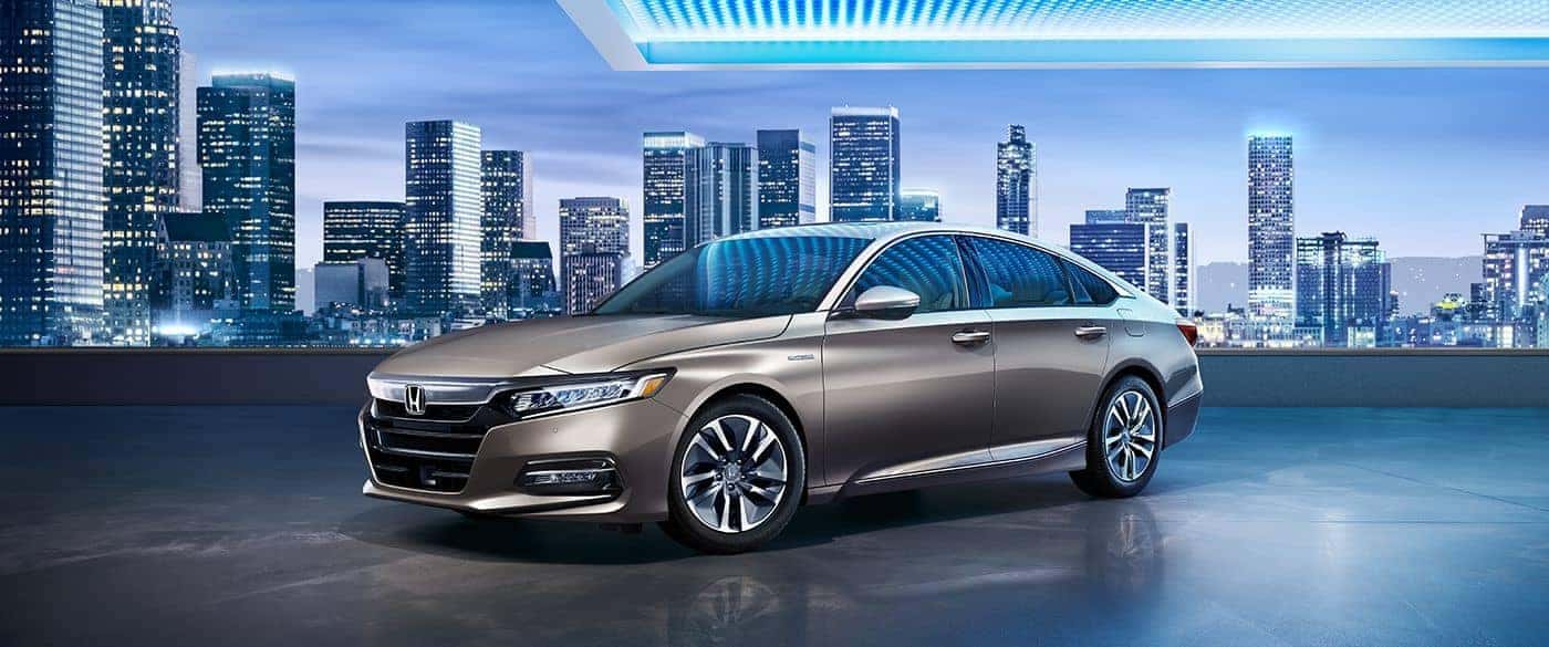 2018 Honda Accord Hybrid parked with the city in the background