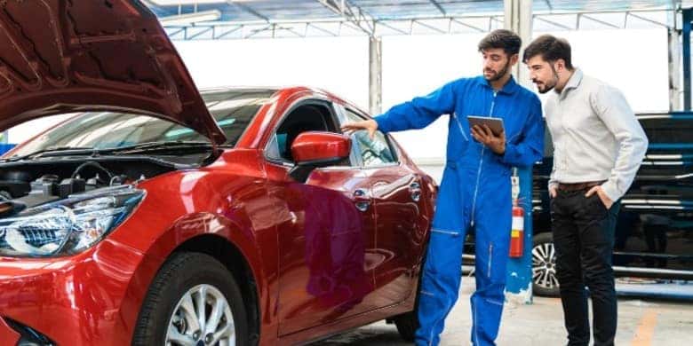 mechanic-showin-a-car