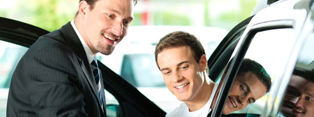 how does buying a car from a dealership work
