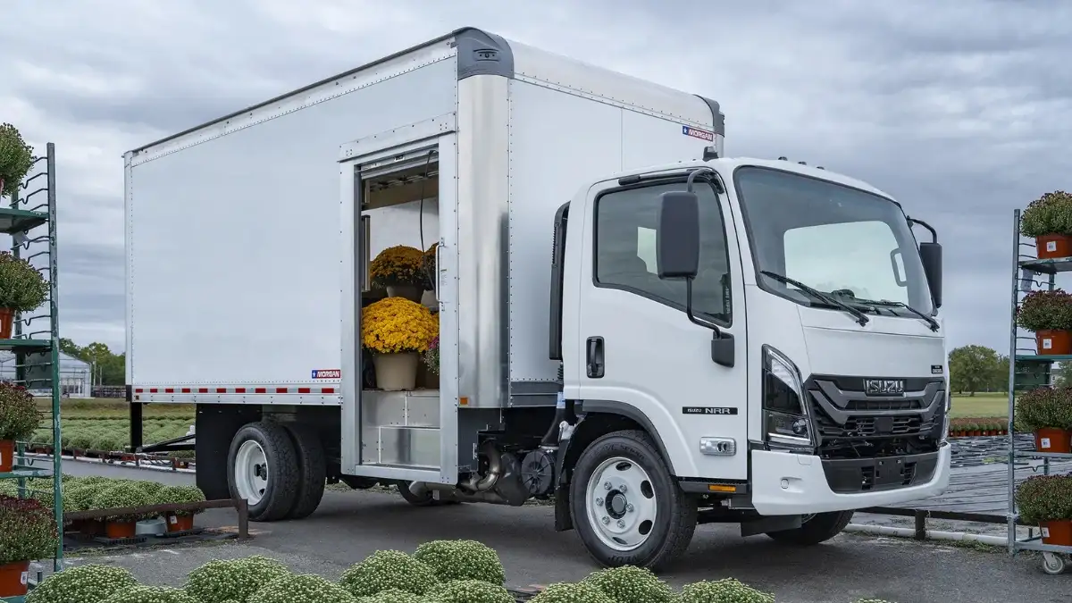 An N-Series diesel truck being loaded with flowers at a plant nursery