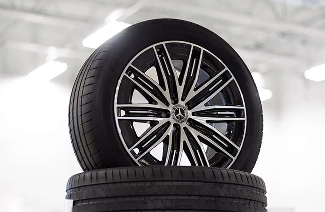 Certified technician servicing tires on a Mercedes-Benz