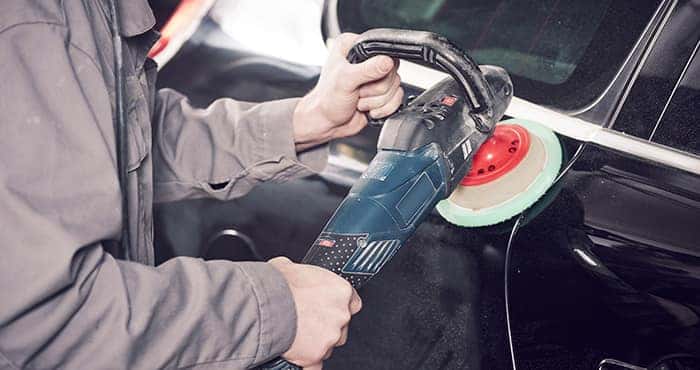 Man Buffing Car