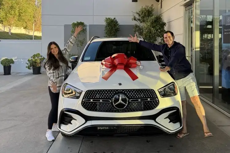 Happy couple who just purchased white GLC