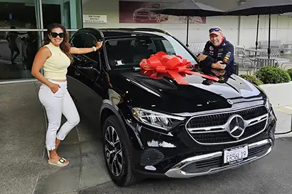 Happy couple who just purchased black GLE