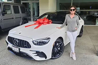 Happy woman who just purchased AMG