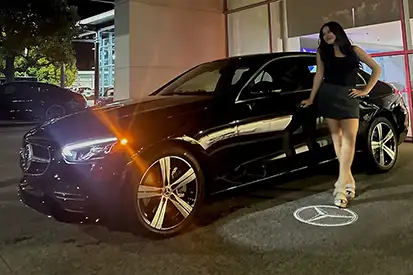 Happy woman who just purchased black C 300