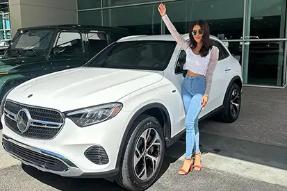 Happy woman who just purchased white GLC
