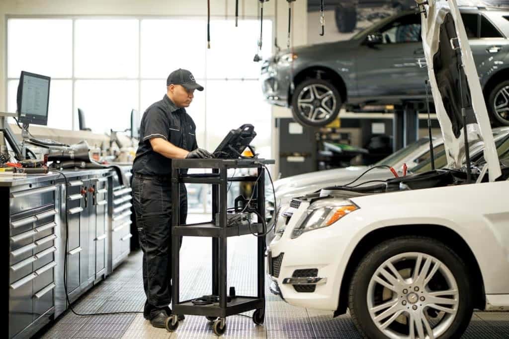 Mercedes-Benz certified technician servicing brakes at Mercedes-Benz of Laguna Niguel