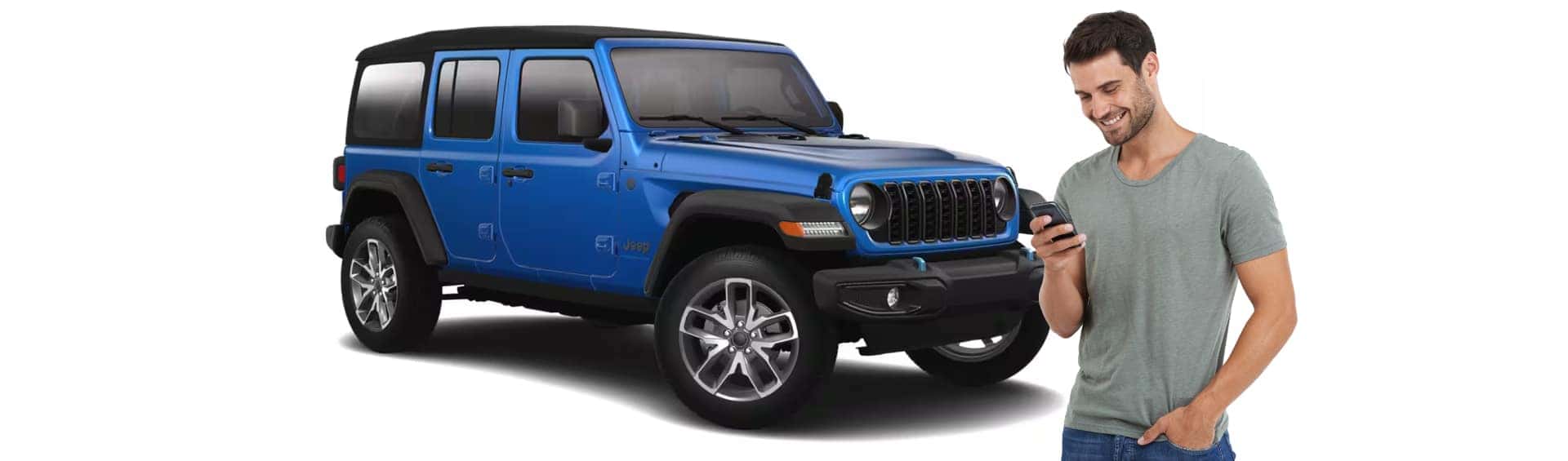 Man on his phone infront of a Blue Jeep Wrangler