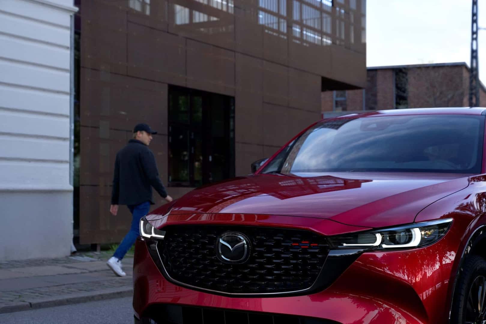 Close up front view of a red Mazda CX-5