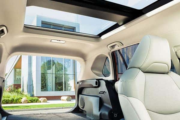 The new 2022 Toyota RAV4 sunroof and open back door.