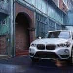 white 2018 BMW X1 parked in an alley