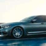 BMW 5 Series cruising down the road