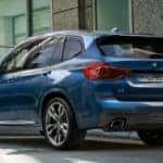 2019 bmw x3 in blue parked in the city