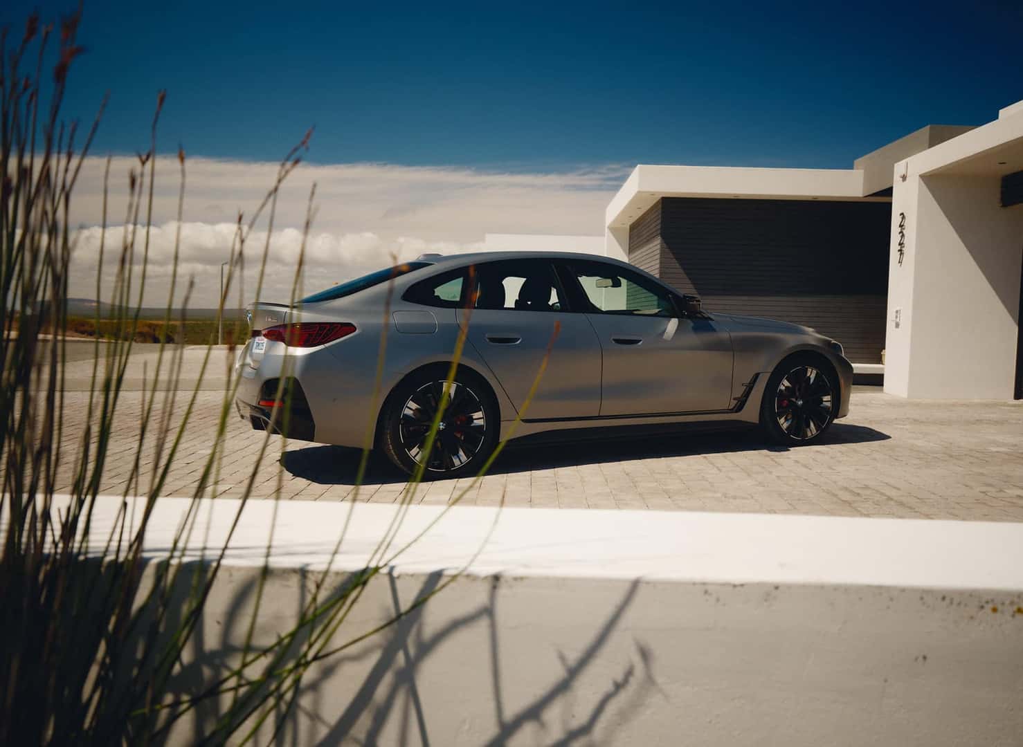 2025 i4 bmw parked by house outside