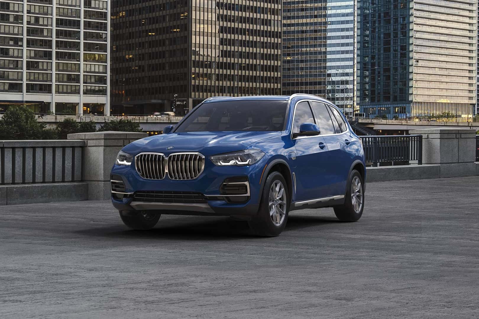 bmw 2022 certified x5 parked in front of city buildings