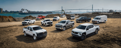 Chevy fleet vehicles parked at a job site