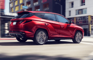 Red SUV driving on the street