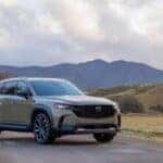 The 2025 Mazda CX-50 in front of rolling hills and an open sky
