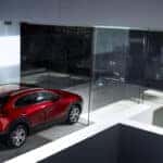 A mazda cx-5 parked in front of a modern minimalist building