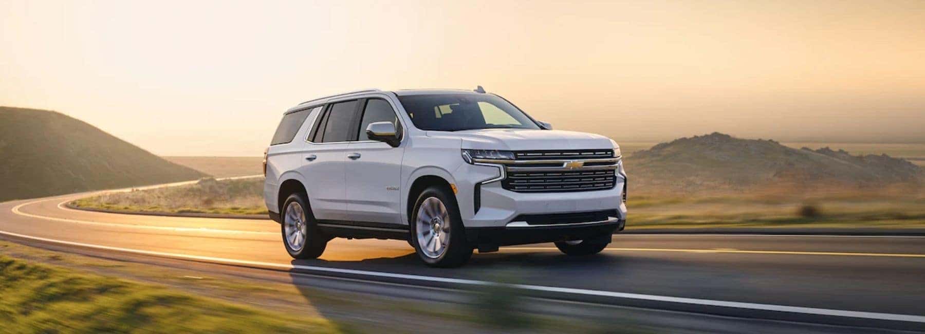 White 2021 Chevrolet Tahoe Driving in Sunlight